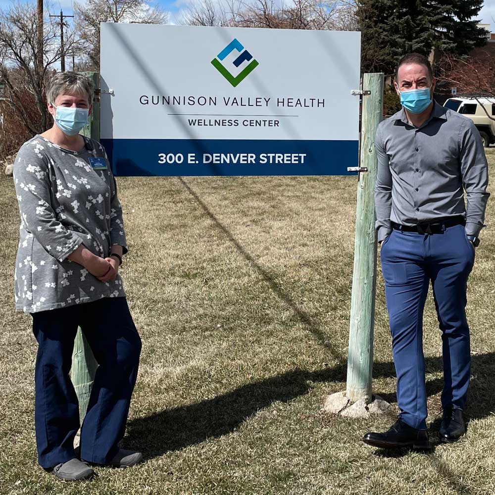 nurses posing with sign