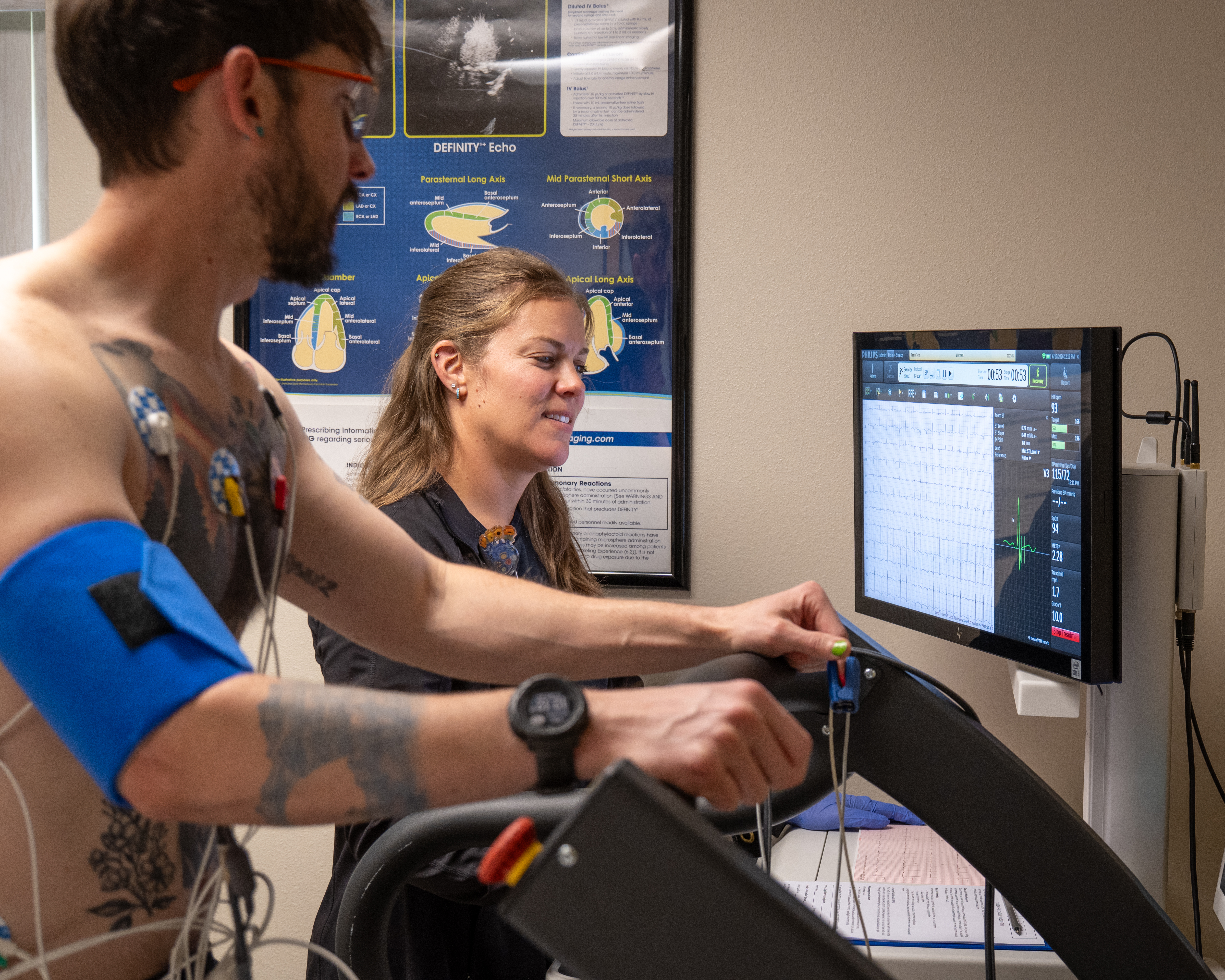 A man on a treadmil hooked up to an ekg machine